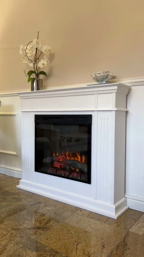 Vertical angle view of handmade white wooden fireplace mantel with electric fire Stockbeeldmateriaal 343158510