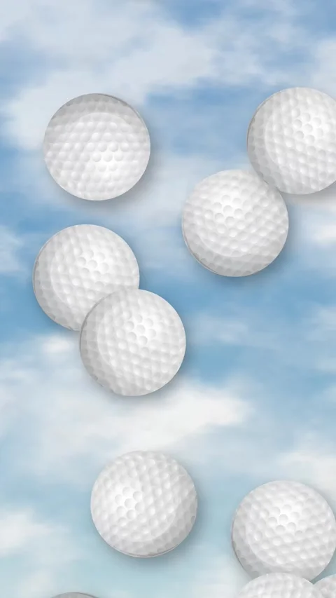 Vertical Animation of Golf Balls Falling Through a Cloudy Blue Sky Stock Footage 344714802