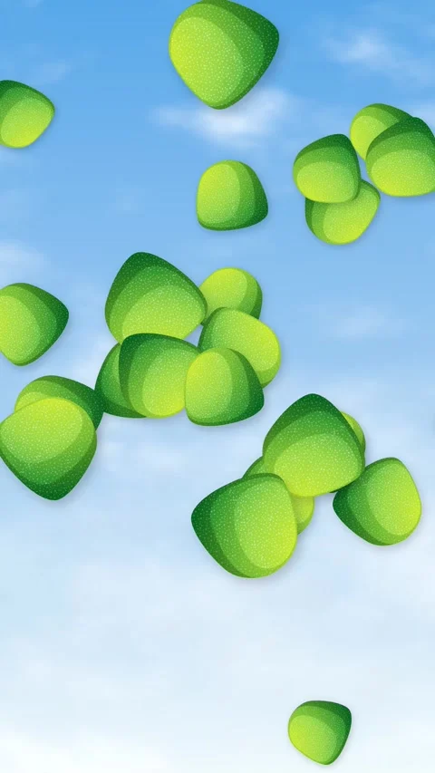 Vertical Animation of Green Candy Pieces Falling Against a Blue Sky Stock Footage 345294044