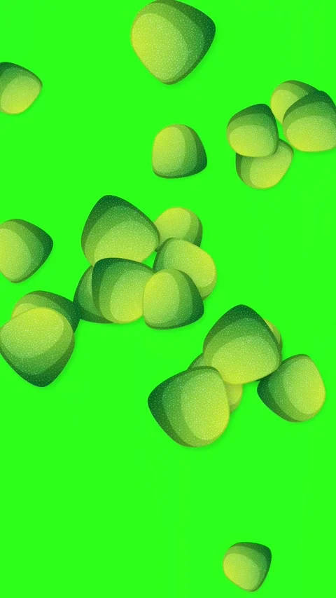 Vertical Animation of Green Candy Pieces Bursting on Green Background Stock Footage 345804033