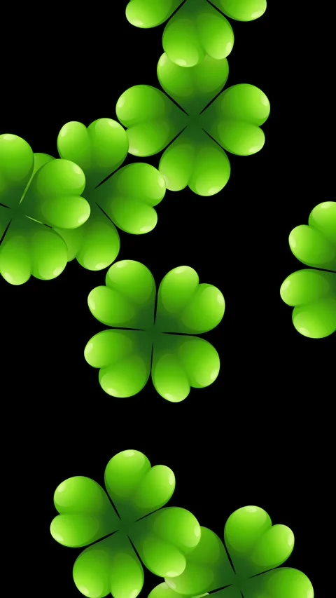 Vertical Animation of Green Four Leaf Clovers Falling on Black Background Video stock 342314140