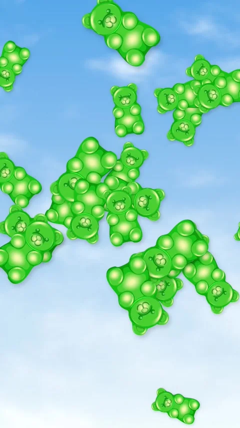 Vertical Animation of Green Gummy Bears Falling Against a Blue Sky Stock Footage 345297189