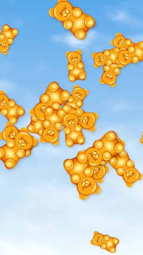 Vertical Animation of Orange Gummy Bears Falling Through a Blue Sky Stock Footage 345041380