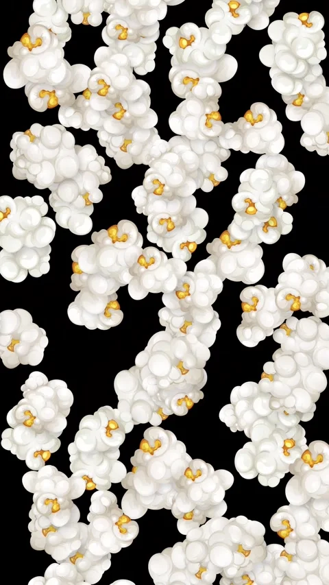 Vertical Animation of Popcorn Kernels Falling Against a Black Background Stock Footage 346435115