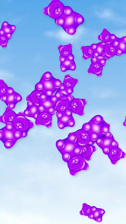 Vertical Animation of Purple Gummy Bears Falling Against a Blue Sky Stock Footage 346435515