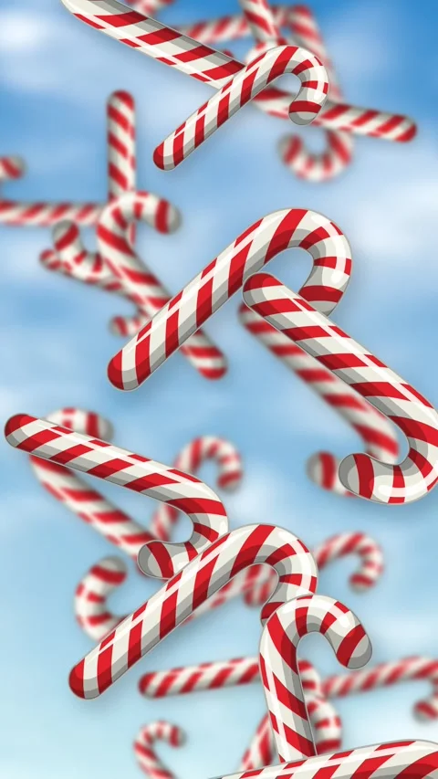 Vertical Animation of Red and White Candy Canes Falling Against Blue Sky Stock Footage 342318813