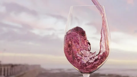 Vertical animation of rose or pink wine pouring in to wine glass in slow motion Video stock 242034311