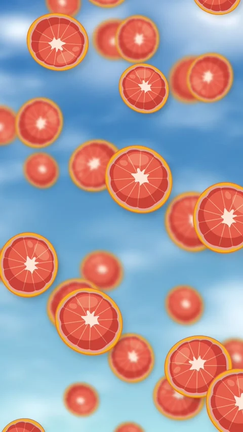Vertical Animation of Sliced Grapefruit Falling Against a Blue Sky Stock Footage 344831605
