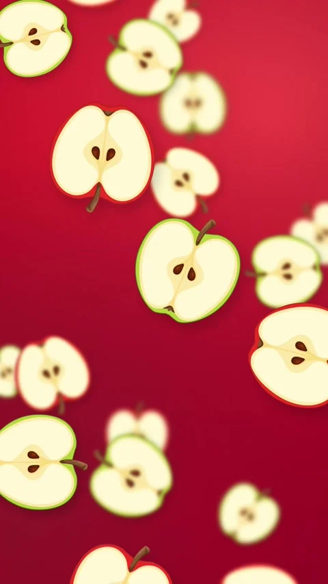 Vertical Animation of Sliced Red and Green Apples Falling on Red Background Stock Footage 345705344
