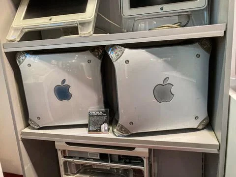Vertical arrangement of Apple Mac Pro computers, gray with vents and LED indi Stock Photos