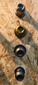 Vertical arrangement of four locking door knobs Foto stock
