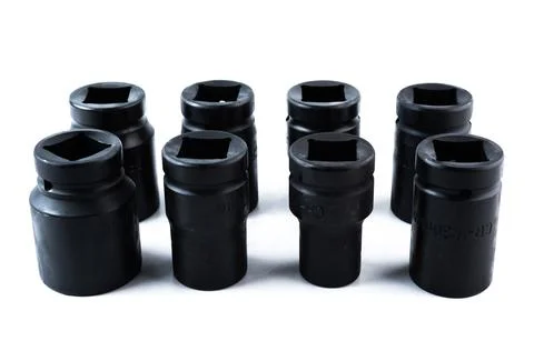 Vertical arrangement of impact sockets in assorted sizes on white backgroun.. Stock Photos