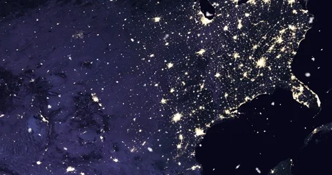 Vertical ascent through light falling snow, over North America, at night. Stock Footage 99431834