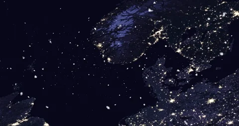 Vertical ascent through light falling snow, over the North Sea, at night. Video stock 99432027