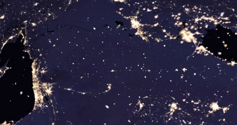 Vertical ascent through light falling snow, over the Holy Land, at night. Video stock 99432545