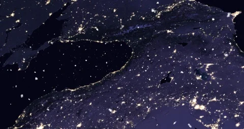 Vertical ascent through light falling snow, over the Baltics, at night. Video stock 99432591