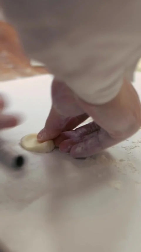 Vertical Asian man making fresh dumplings in a kitchen restaurant of Taiwan Stock Footage 310853614