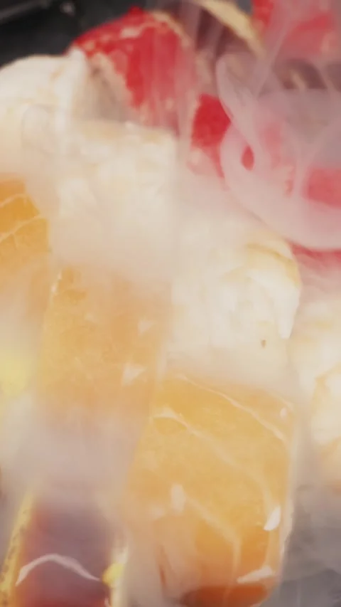Vertical Assorted Sushi Set With Flowing Cold Dry Ice Vapor Stock Footage 326035910