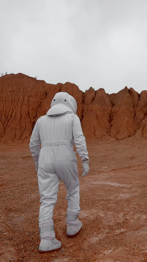 Vertical of The astronaut goes to explore the surface of Mars in a special suit. Stock Footage 275624058
