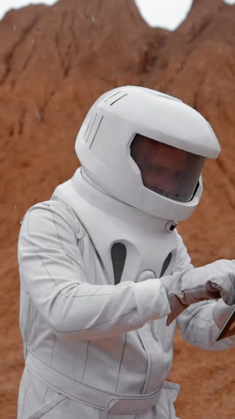 Vertical of The astronaut is trying to fix a non-working tablet Stock Footage 275621232