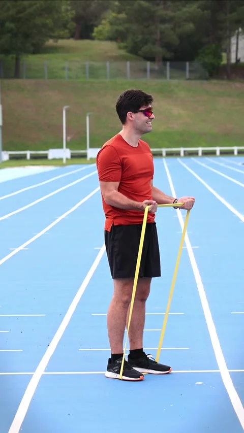 Vertical Athlete with Sunglasses Training Biceps Muscles Using Resistance B.. Stock Footage 277500907