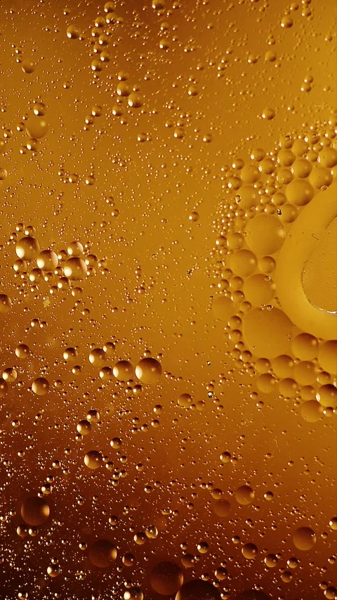 Vertical atmospheric orange fluid background fading in and out of darkness Stock Footage 341825094