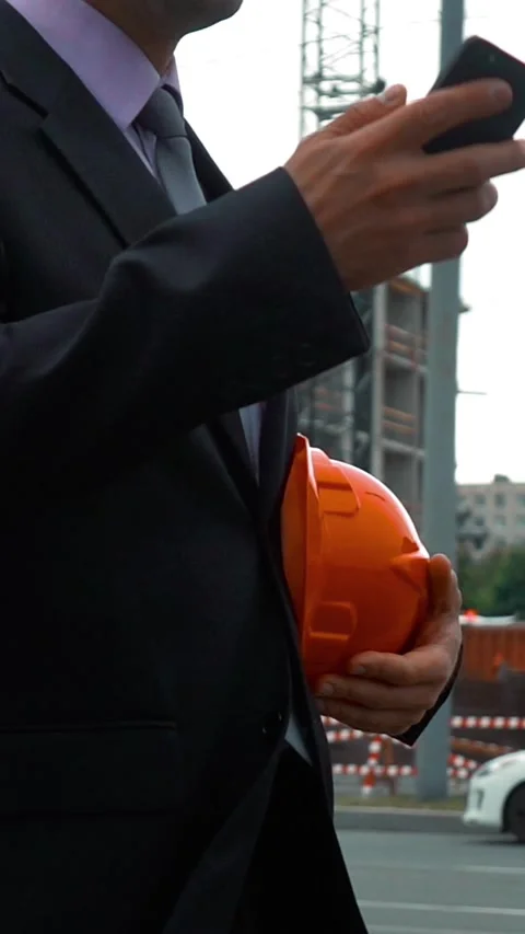 Vertical of Attractive construction engineer answering call. Stock Footage 305505120