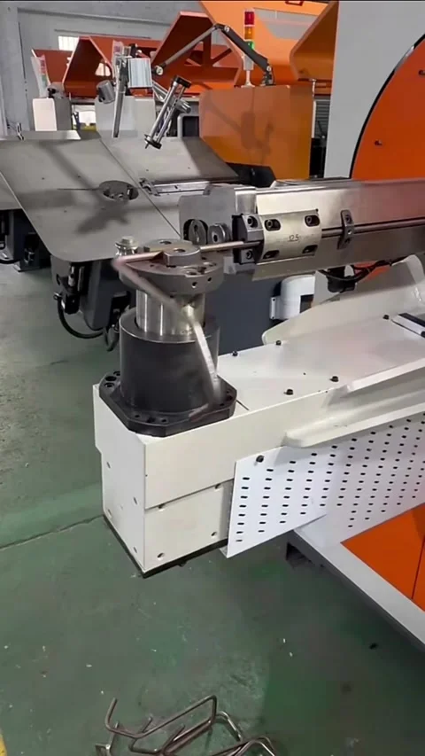 Vertical Automated CNC Wire Bending Machine Forming Metal Component in Facto Stock Footage 327103203