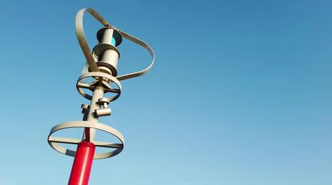 Vertical axis wind turbine producing electric energy with the wind energy. Stock Photos