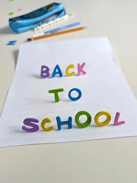 Vertical back to school concept featuring colorful three dimensional foam let Stock Photos