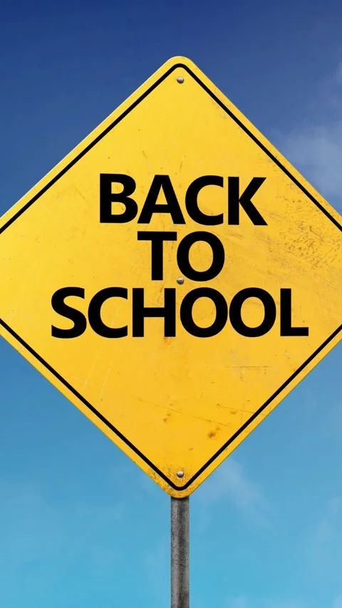 Vertical Back to School Road Sign Blue Skies 4K Loop Stock Footage 276283538