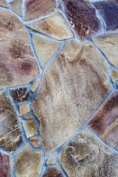 Vertical background in the form of stone tiles. Stock Photos