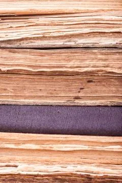 Vertical background stack of old books closeup Stock Photos