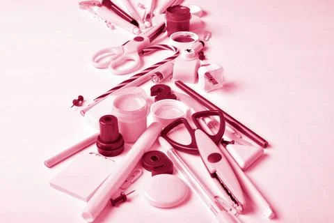 Vertical background with various stationery. Color 2023, viva magenta. Stock Photos