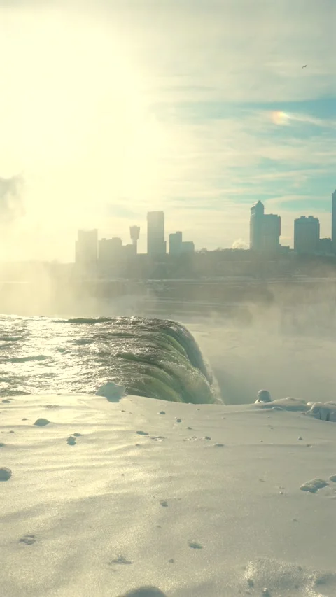 Vertical Backlit Winter View Of Niagara Falls Mist And Skyline In Sunlight Stock-Footage 342331317
