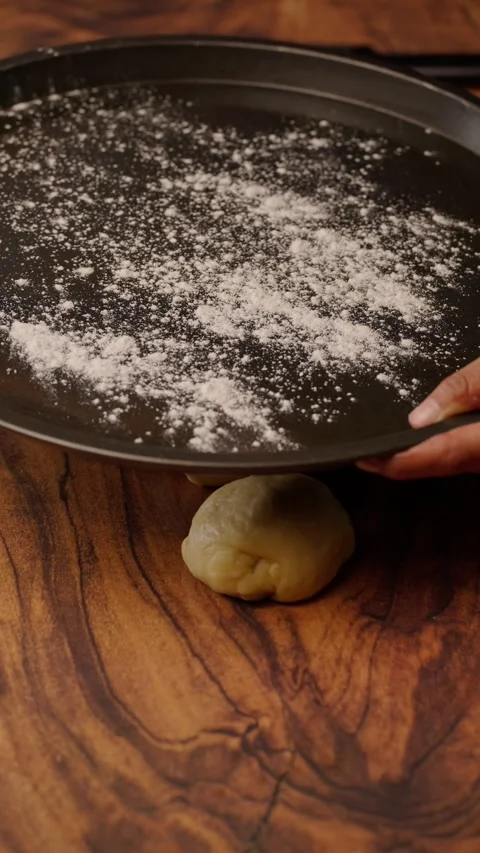 Vertical bakery video, dusting a baking sheet with flour Stock Footage 282499323