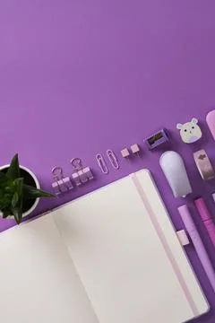 Vertical banner with open notepad and stationery, felt-tip pens, stapler, rul Stock Photos