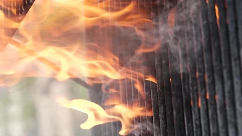 Vertical barbecue grill, slow motion bbq fire flame burning, cooking outdoors Stock Footage 211587626