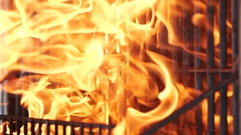 Vertical barbecue grill, slow motion bbq burning fire flame, closeup fireplace 動画素材 256739687