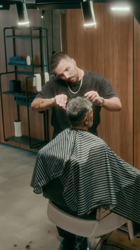 Vertical of Barber Thinning Hair Ends while Finishing Crew Cut Stock Footage 317584774