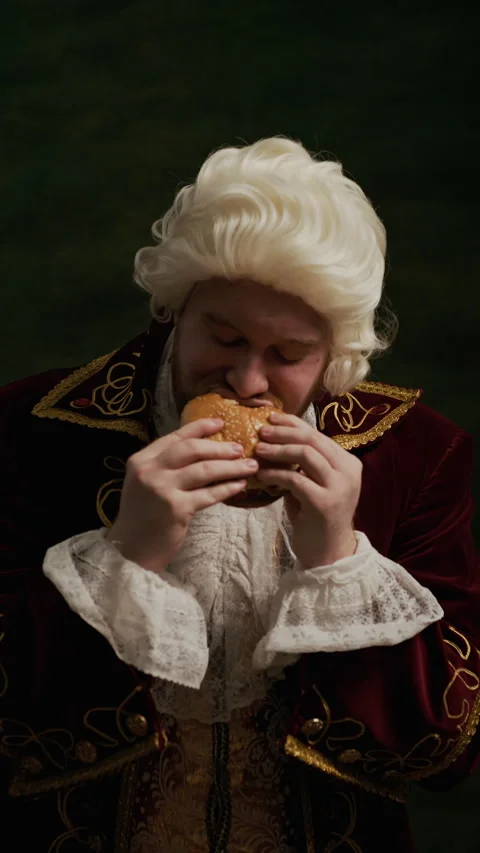Vertical of Baroque Nobleman Tasting Hamburger for First Time Stock Footage 333569193