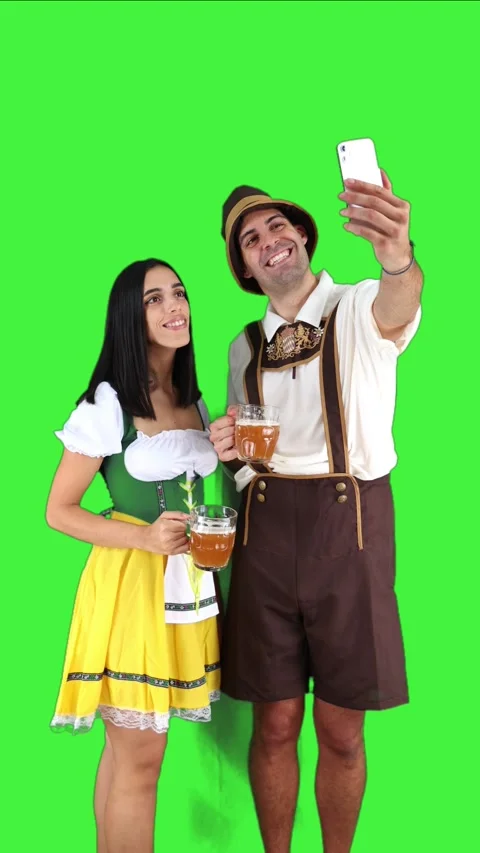 Vertical bavarian young couple taking selfie with smartphone in traditional.. Stock Footage 281192355