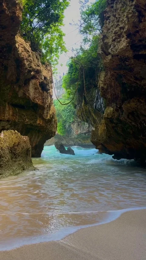 Vertical Beautiful Hidden Tropical Beach Cove with Massive Rock Cliffs Stock Footage 335189018