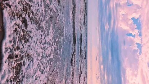 Vertical. Beautiful Sea Waves Falling Slowly on Sandy Beach at Sunrise Light Pin Stock Footage 297457849