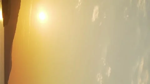 Vertical, Beautiful Sunset Yellow Orange Blue Sky Sun and High Clouds on the Sea Stock Footage 274901575