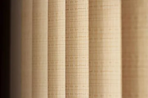 Vertical beige blinds on the windows,Image with selective focus. Stock Photos