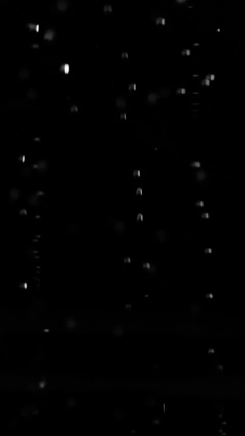 Vertical big large air bubbles floating and rising nonstop on black background. Vídeo Stock 337450674
