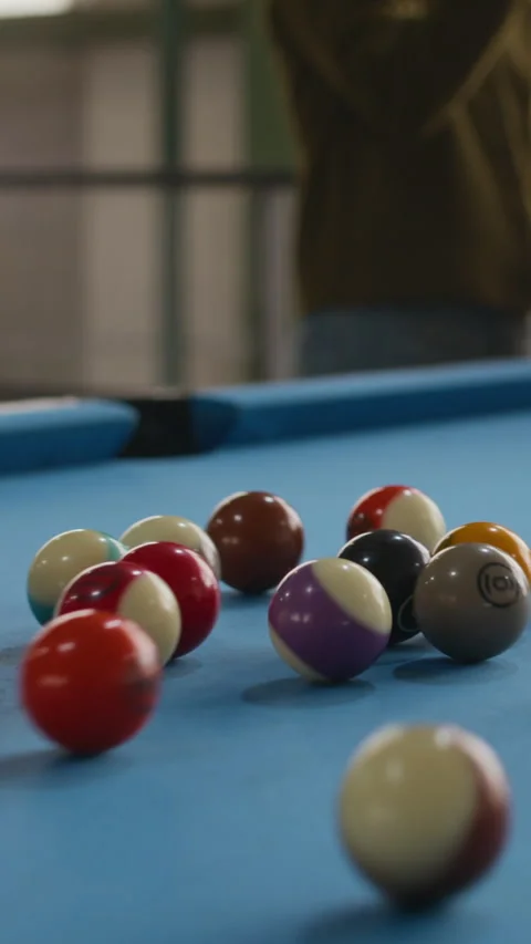 Vertical of Billiard Balls Rolling Across Table After Opening Break Stock Footage 332765699