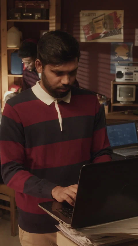 Vertical of Biracial Programmed Coding on Laptop in Vintage Style Office Stock Footage 276415284