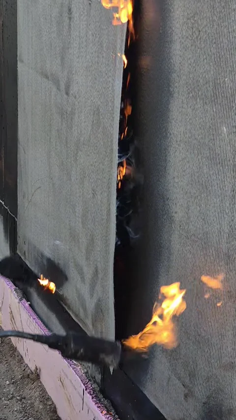 Vertical Bitumen Waterproofing with Gas Torch Slow Motion Vídeos de archivo 331536969